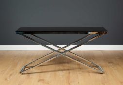 A contemporary chrome plated X framed console table with black glass top, 134cm wide x 40cm deep x