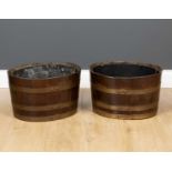 A pair of coopered oak zinc lined oval jardinieres 42cm wide x 35cm deep x 26cm high (2)Condition