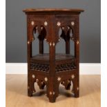 An early 20th century Moorish hardwood hexagonal occasional table with carved Islamic script and