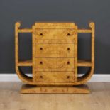 An art deco style burr maple veneered shaped side cabinet with four central drawers, 106cm wide x