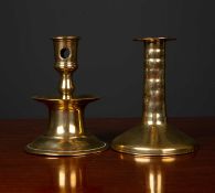 A mid to late 17th century brass candlestick with turned stem and spreading base, 9.5cm diameter x