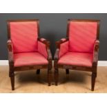 A pair of empire style mahogany framed library armchairs with reeded decoration around the seat