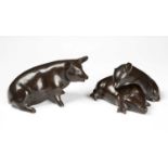 A sculptural group of three bronze pigs the largest 14cm long snout to tailCondition report: In good