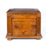 An antique Italian pine chest with fluted pilaster columns to the front beneath the lifting lid,