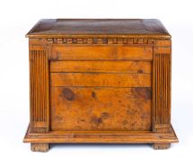 An antique Italian pine chest with fluted pilaster columns to the front beneath the lifting lid,