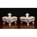 A pair of French porcelain sweetmeat dishes with rotating lids, painted with animals and figures