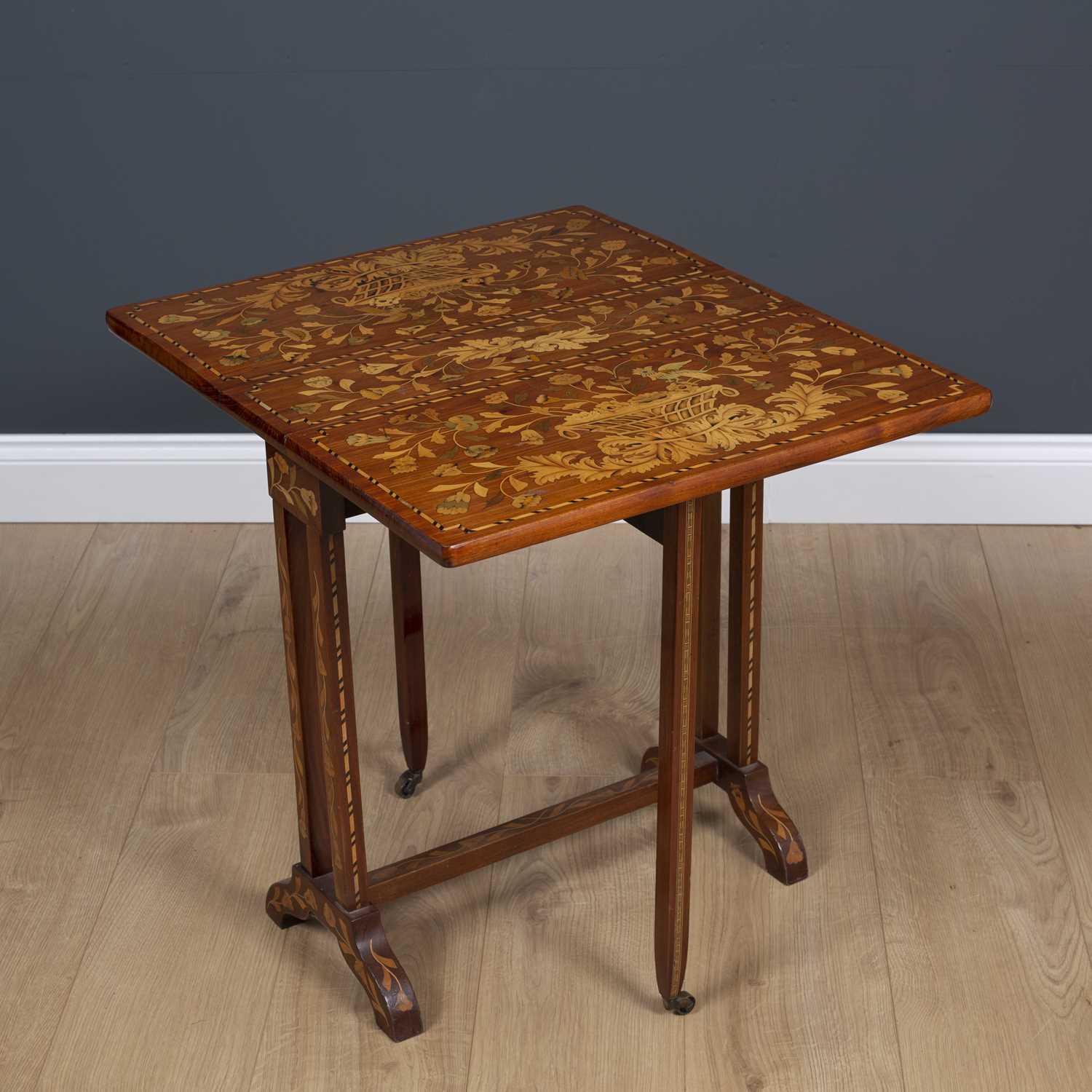 A Dutch mahogany Sutherland table profusely decorated with floral inlay stamped KOOPMAN and Co 1903, - Image 3 of 7