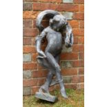 An antique lead sculpture depicting a child dancing with a shawl swirling around its arms and