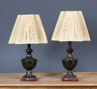 A pair of cast and painted metal table lamps of urn form, each 46cm in height excluding