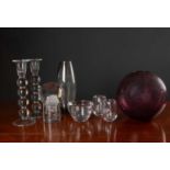 A collection of eight pieces of art glass to include a Kosta Boda sculptural paperweight with bubble