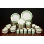 An Italian Richard Ginori porcelain dinner and coffee service decorated in gold and green in the '