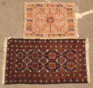 An unusual cream ground hand woven woollen rug with stylised animal designs, 130cm x 103cm