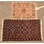 An unusual cream ground hand woven woollen rug with stylised animal designs, 130cm x 103cm