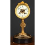 A French mantle clock the drum case on a reeded column, stepped circular plinth, the dial with