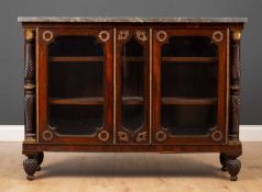 A 19th century French empire style rosewood marble topped side cabinet with gilt mounts, twin glazed
