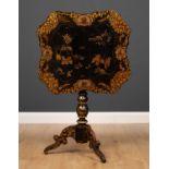 A Regency ebonized tilt top tripod table, the top with lacquered chinoiserie decoration depicting