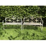 A pair of wrought iron benches, with scroll decorated backs, 114.5cm x 44cm x 91cmQty: 2Condition