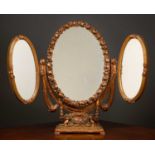 An early to mid 20th century gilt moulded gesso triple plate dressing table mirror each oval