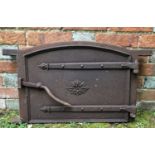 A 19th century cast iron bread oven door and frame 74cm wide x 44cm highCondition report: Surface