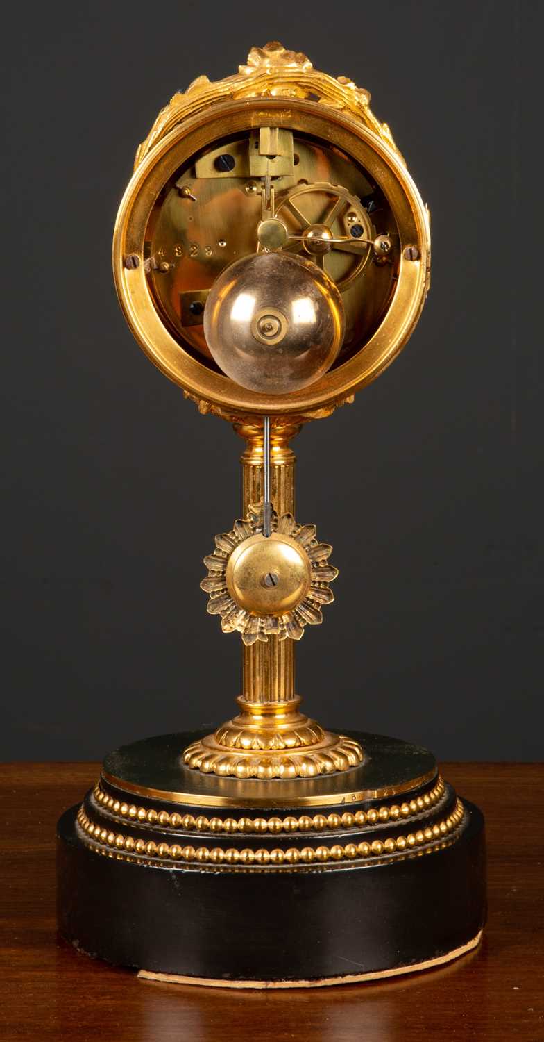 A French mantle clock the drum case on a reeded column, stepped circular plinth, the dial with - Image 3 of 5