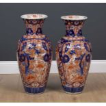A pair of large Imari porcelain vases decorated with trees and flowers, 27cm diameter x 61cm