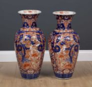 A pair of large Imari porcelain vases decorated with trees and flowers, 27cm diameter x 61cm