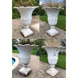 A set of four Victorian cast iron urns of tulip form and on square bases, 60cm diameter x 75cm