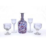 An antique possible continental glass decanter decorated with blue and red flecks, together with a