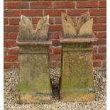 A pair of late 19th century buff terracotta square section crown topped chimney pots, each