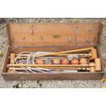 A Jaques croquet set in a pine box with seven mallets, eight turned balls, ten large white painted