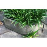 A heavy carved stone trough with D shaped end, 89cm long x 55cm deep x 35cm highCondition report: in