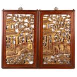 A pair of early 20th century Chinese carved and gilded wooden panels, each 32cm x 52cmCondition