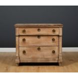A limed oak chest of three long graduated drawers from Sybil Colefax and John Fowler, with ring