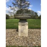 An old cast reconstituted stone fluted bowl on a square plinth base, 84cm diameter x 48cm