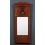 A Regency mahogany narrow pier glass or mirror with ebony inlay and applied pressed metal mounts,