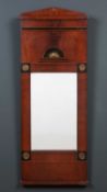 A Regency mahogany narrow pier glass or mirror with ebony inlay and applied pressed metal mounts,
