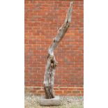 A weathered fluted tree branch sculpture on a rectangular plinth base, 220cm highCondition report: