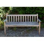 A small teak garden bench 158cm wideCondition report: In weathered condition