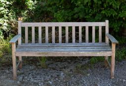 A small teak garden bench 158cm wideCondition report: In weathered condition