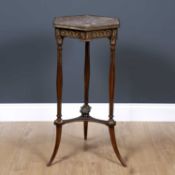 A French marble topped and ormolu mounted hexagonal walnut torchiere, the three fluted legs united