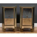 A pair of modern bevelled glass panelled bedside cabinets each with single doors and square tapering