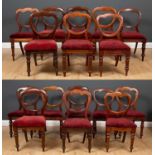 A matched group of sixteen Victorian balloon back dining chairs with shaped backs and turned