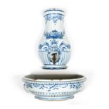 An 18th century French Rouen faience lavabo decorated in cobalt blue with half round baluster