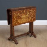 A Dutch mahogany Sutherland table profusely decorated with floral inlay stamped KOOPMAN and Co 1903,