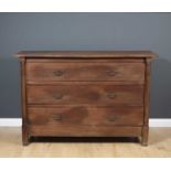A 19th century French oak three drawer commode, the three drawers flanked by pilaster columns and