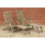 A pair of teak and brass reclining steamer chairs with foot rests, approximately 145cm long