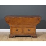 A continental fruitwood chest with a lifting top above two drawers, raised on bracket feet, 120cm