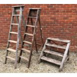 A set of pine steps 73.5cm wide x 72cm high together with two old step ladders (3)Condition