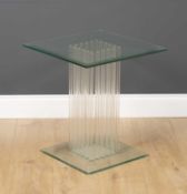 A contemporary square glass occasional table with multiple supporting stems to the centre and on a