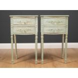 A pair of bow fronted green painted bedside tables each with two drawers and standing on turned